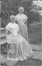 SA1348.4 - Two women near the steps of building. Identified on the back., Winterthur Shaker Photograph and Post Card Collection 1851 to 1921c